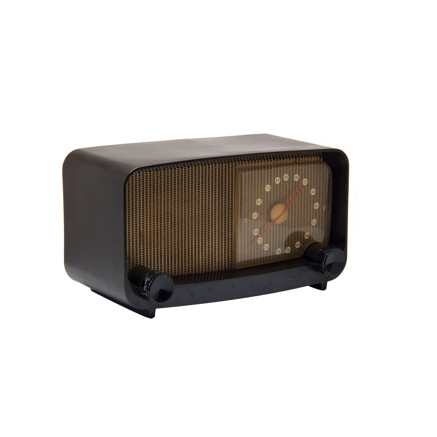 Rectangular table radio with dark brown plastic housing The housing has rounded corners and opens at the front to a gold-colored speaker and clear plastic radio dial with white number markers and a red needle.
