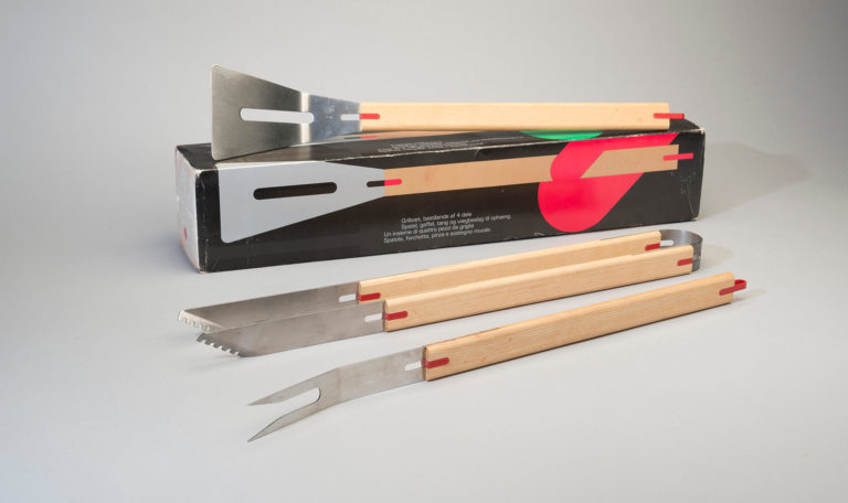 Set of metal barbecue tools with wooden handles.