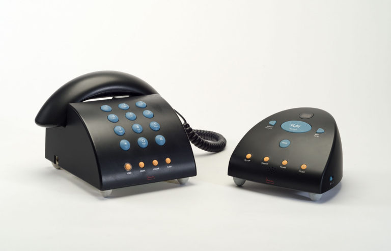 Curved black telephone and answering machine with blue and yellow buttons.