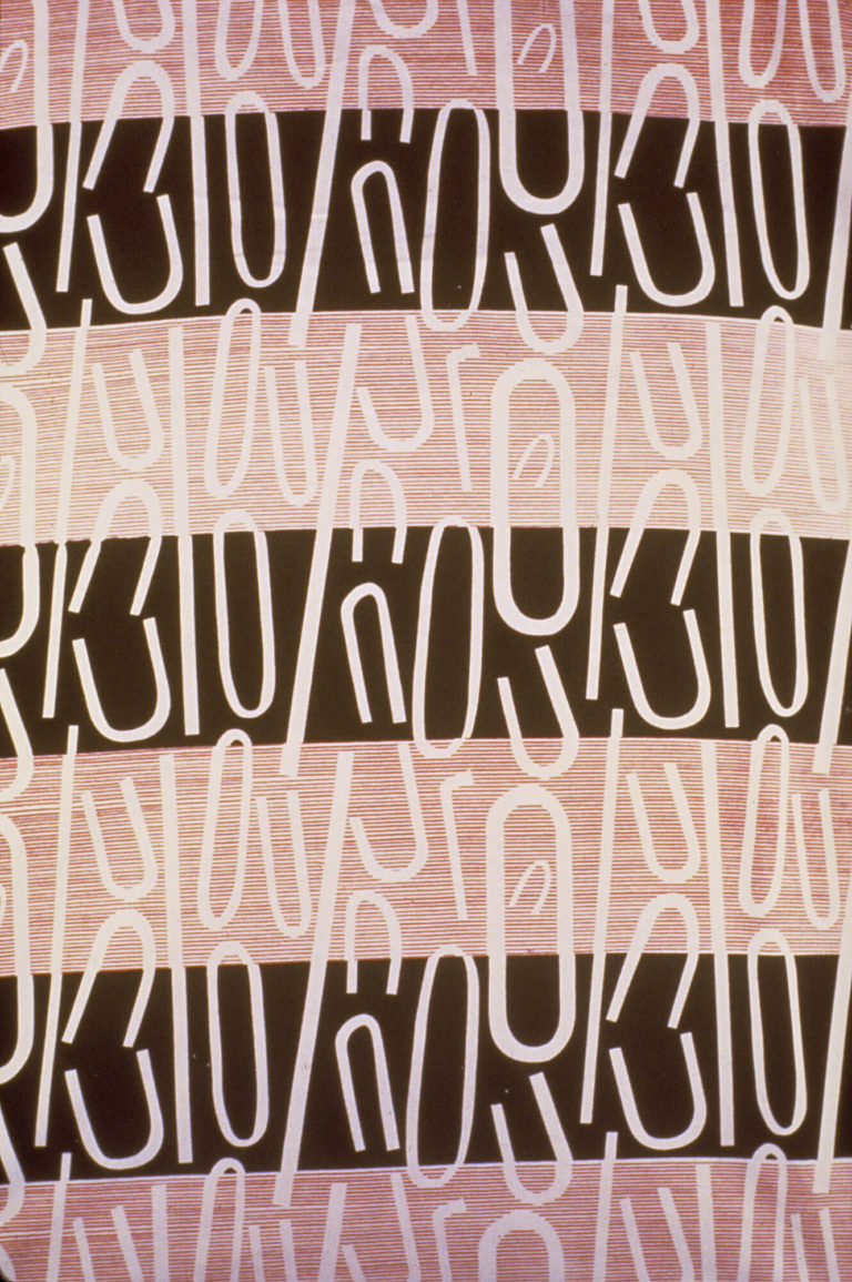 Textile with alternating horizontal stripes of dark brown and shades of pink with an overlying pattern of shapes like parts of paperclips.