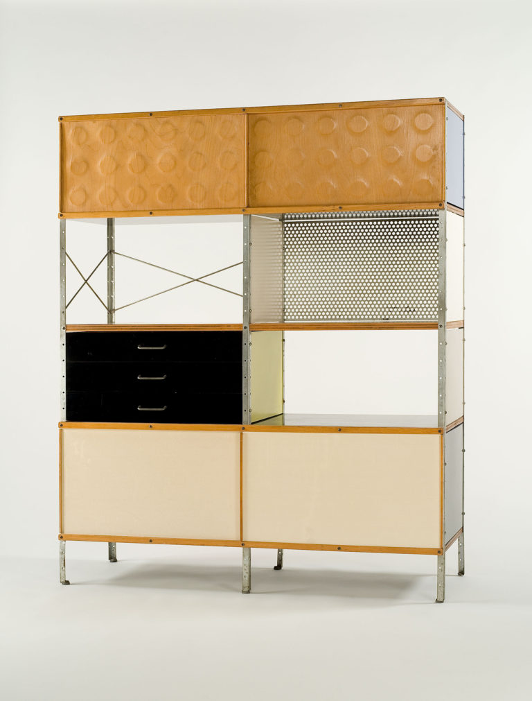 Tall storage unit with a steel frame and modular drawer, cabinet, and shelf components in different materials and colors.