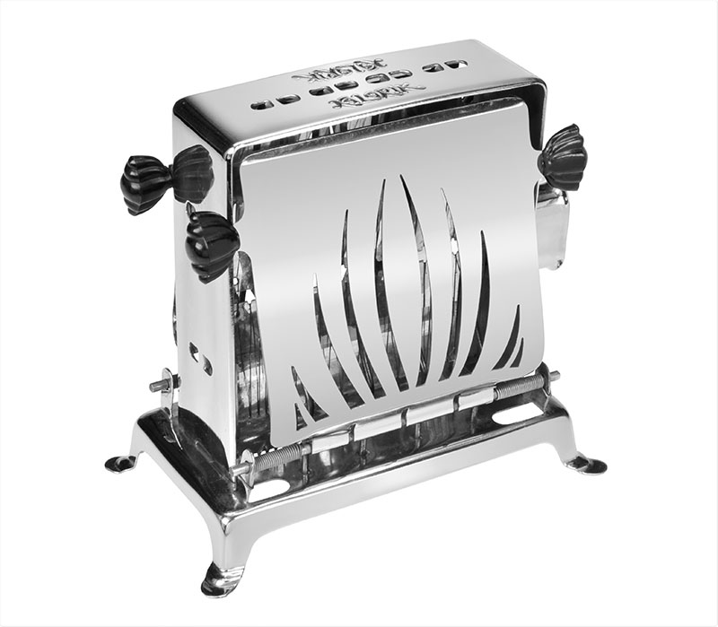 Old fashioned toaster of shiny metal with perforated doors and molded black handles set on four short metal legs.