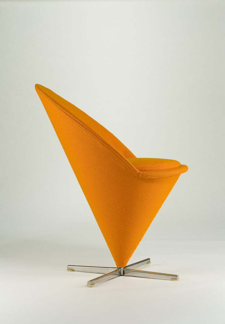 Bright orange conical chair with a crisscross steel base.