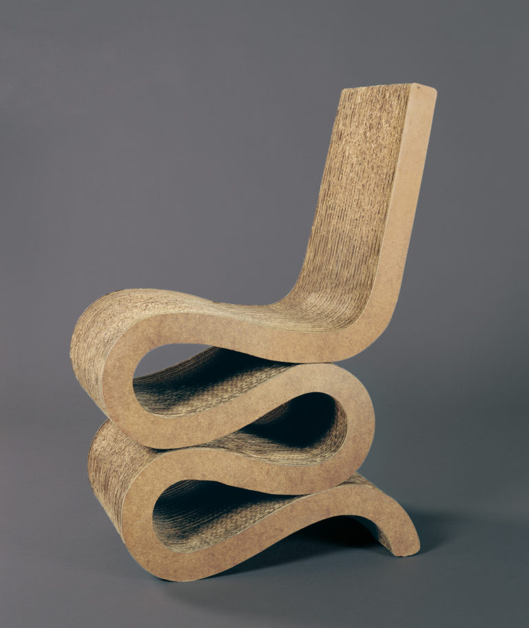 Chair made of corrugated cardboard cut and assembled into a squiggle shape with a straight seatback.