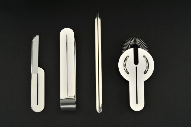 Set of four rounded and perforated bar tools in shining metal.