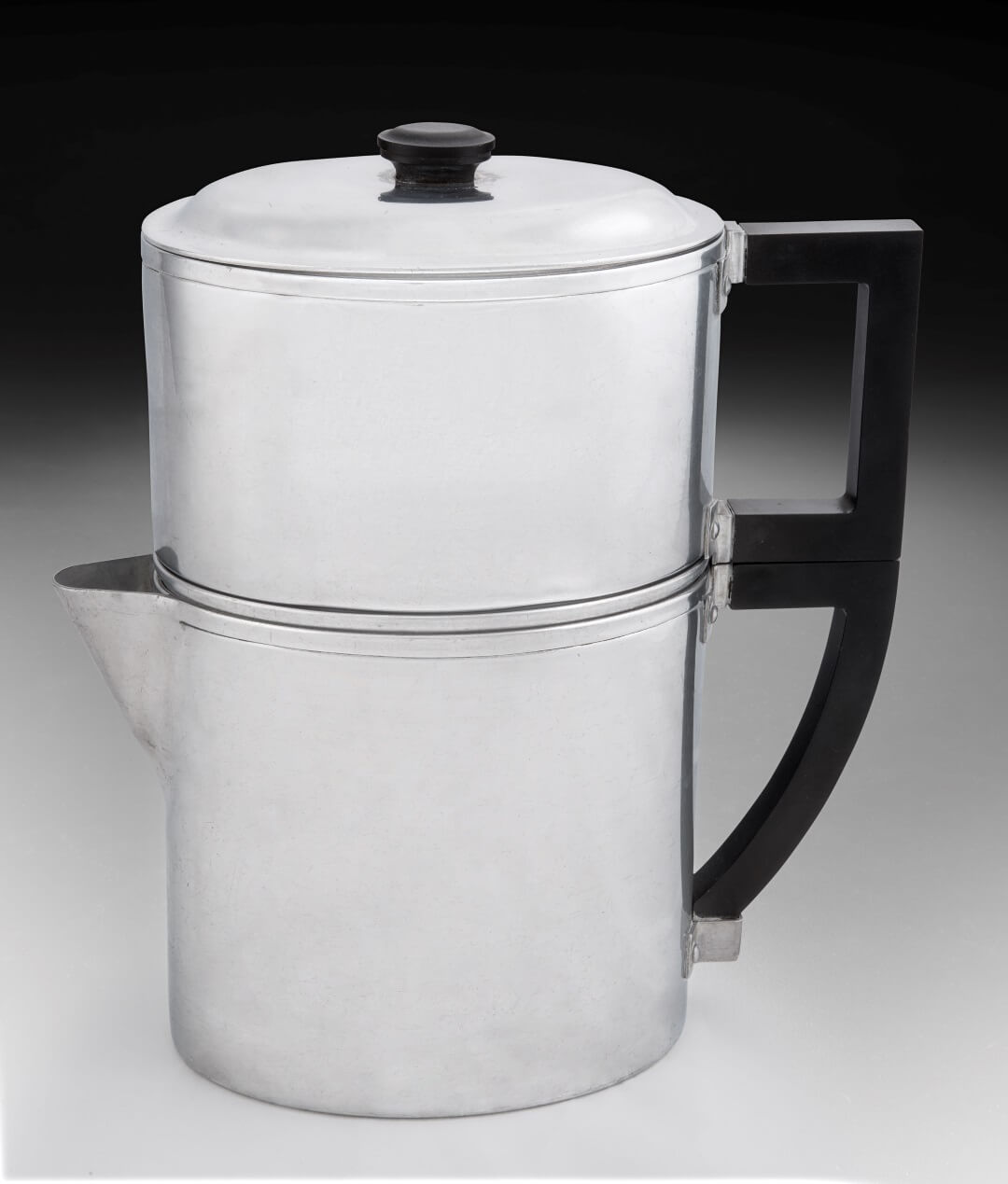 Simple aluminum coffeepot with geometric handle and finial.