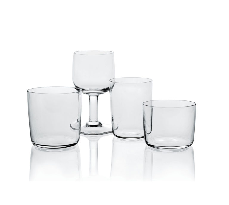 Four clear glasses. Three tumbler-shaped glasses of different sizes and one stemmed glass.