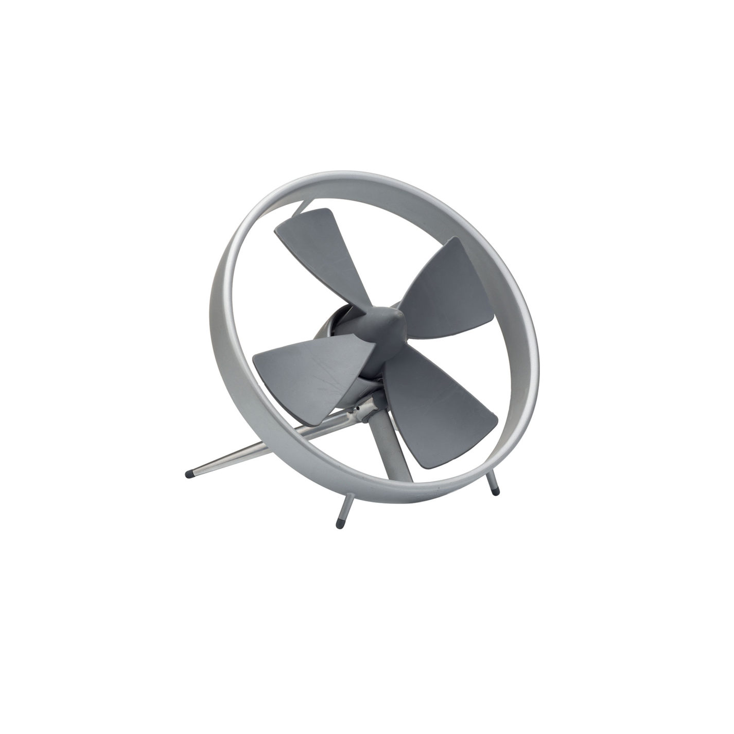 Table fan. A circle of aluminum surrounds a grey propeller with four fins and a pointed center. It leans back on an angled support behind.